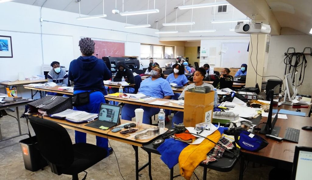 Hands-on career training at PTTI US with students learning in a practical classroom.