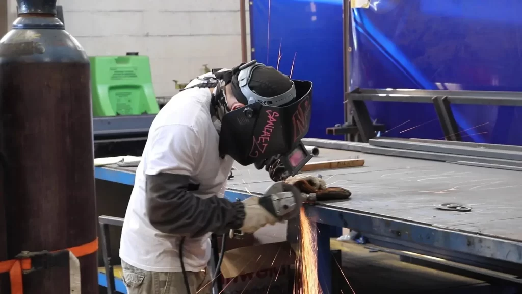 Instructor guiding a student in hands-on welding training for a union apprenticeship