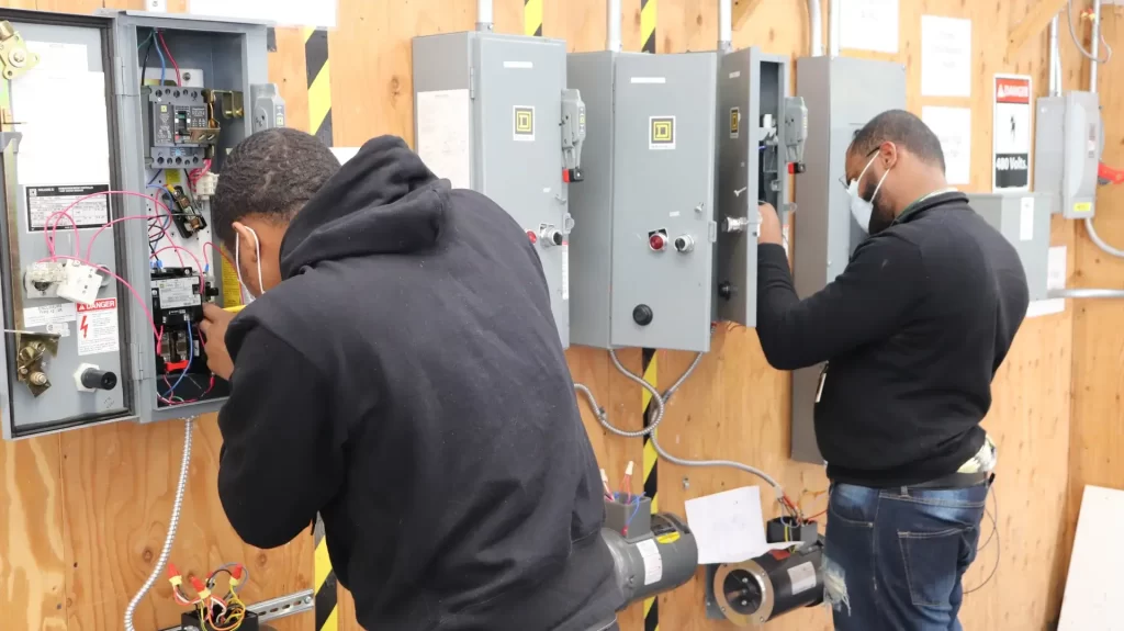 Industrial maintenance technician servicing an automated production line