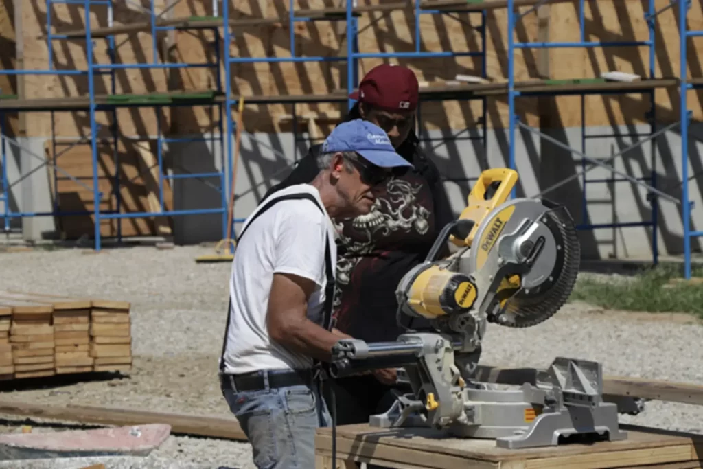 Masonry student completing a concrete wall project during construction technician training in Philadelphia