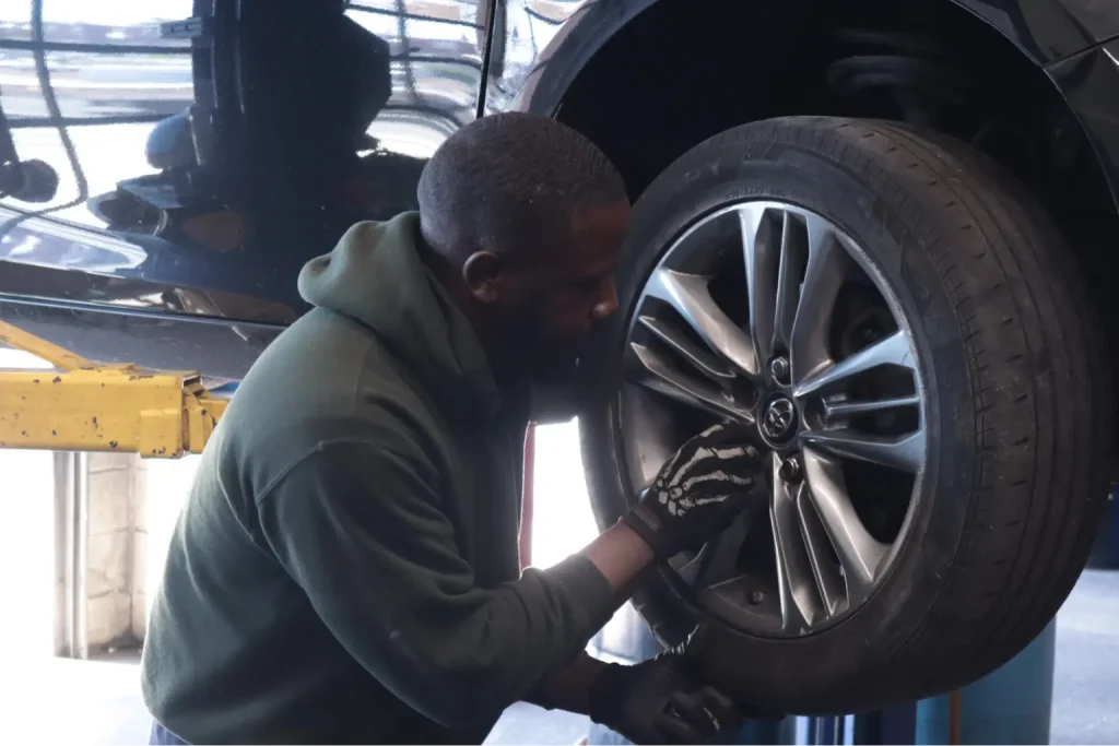 A PTTI student at automotive repair shop.