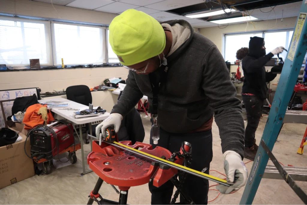 Pipefitting students practicing at a Philadelphia training campus.