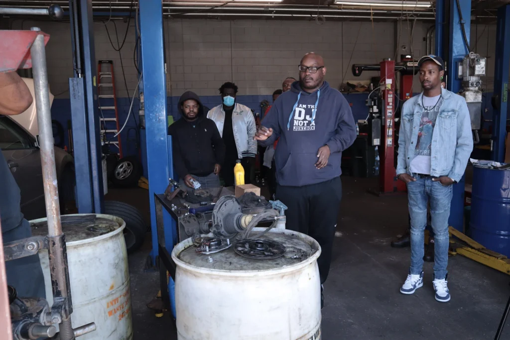 PTTI automotive shop at the Ogontz Avenue campus with students in hands-on automotive training in Philadelphia
