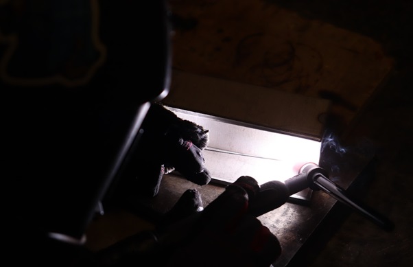 student doing welding