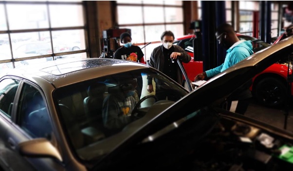 A private garage mechanic fixing an engine.