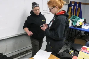 Instructor teaching skilled trades students in a Philadelphia trade school workshop