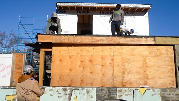 Adult students gain hands-on construction experience during framing training at PTTI.