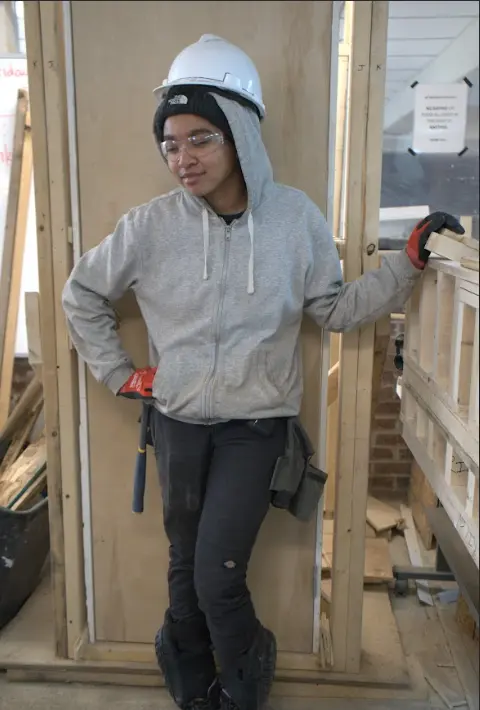 Student receiving hands-on trade training at a Philadelphia trade institute construction lab.