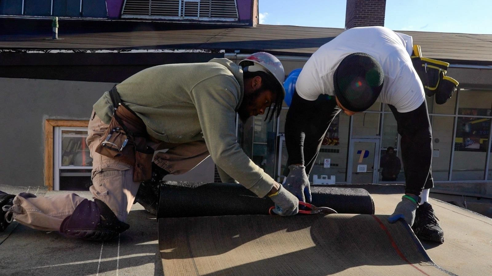 PTTI student Practicing with roof sheets at residential building.