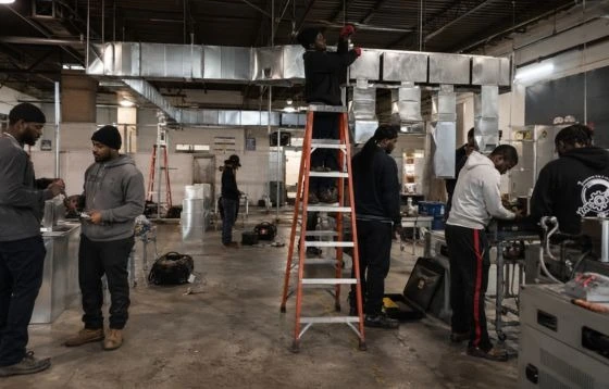students at work site of HVAC installation. 