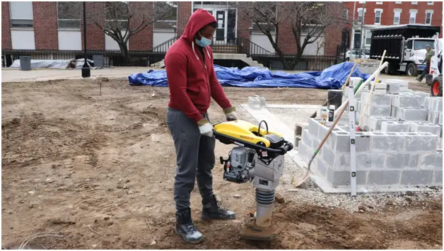 A PTTI student at a construction site