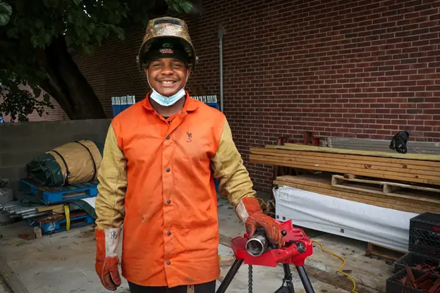 Welding student practicing pipe fabrication at a Philadelphia trade institute.