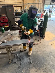 A welder wearing safety kit