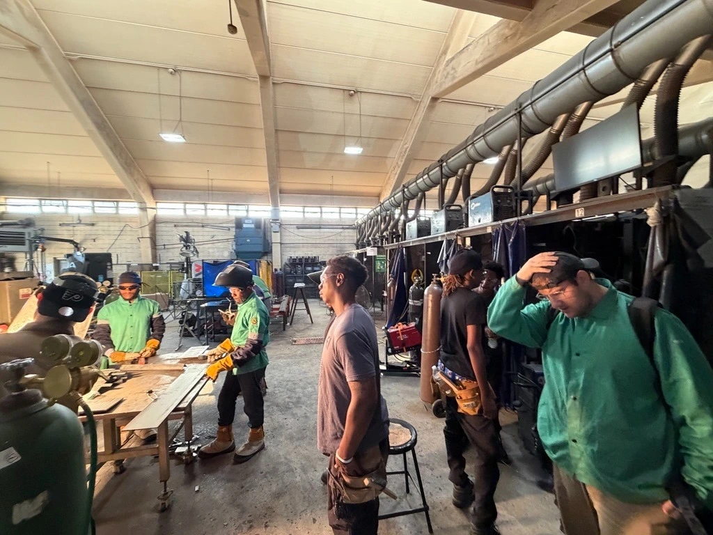 Trade school student using industry equipment during hands-on practical training