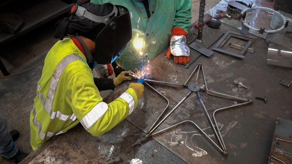 A welding Technician prcticing with welding tools