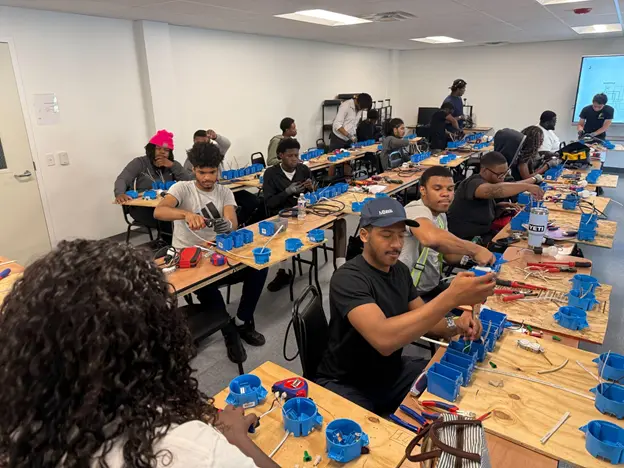 students learning about tools at work lab
