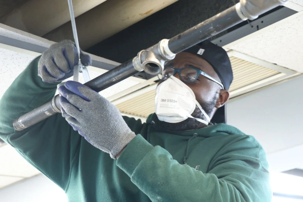 A pipefitter at a work site