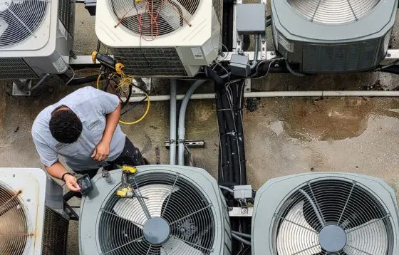An HVAC technician at work site