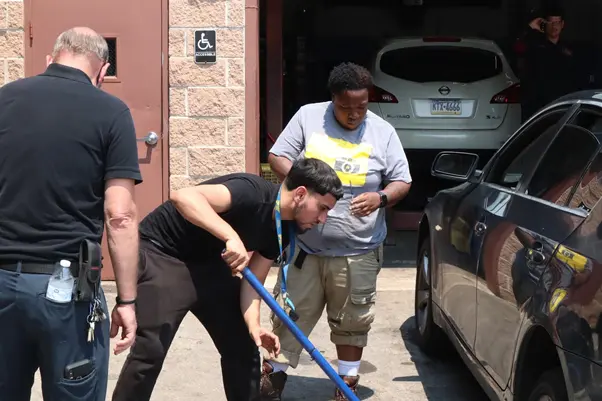 Trade school students gaining hands-on automotive technology training