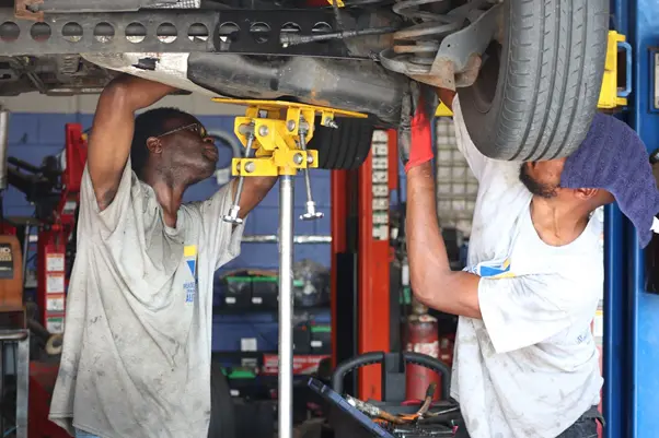 Learning automotive repair skills through hands-on trade school training