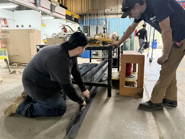 Students receiving hands-on training with support from trade mentors 