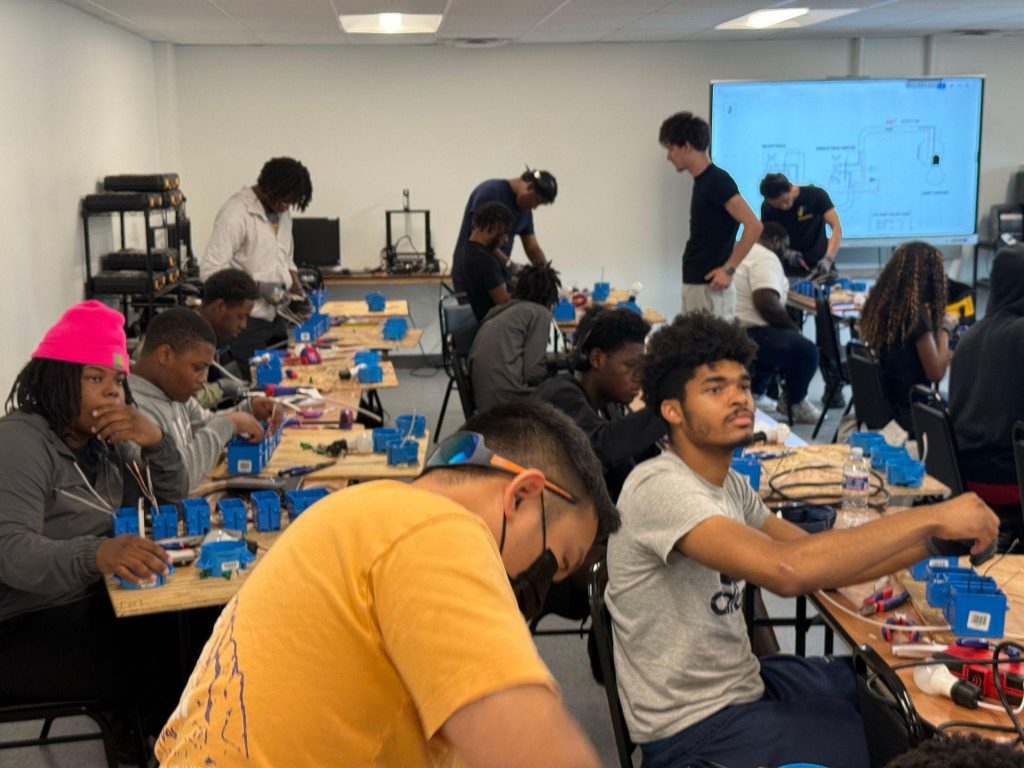 Gen Z students gaining hands-on experience with trade equipment