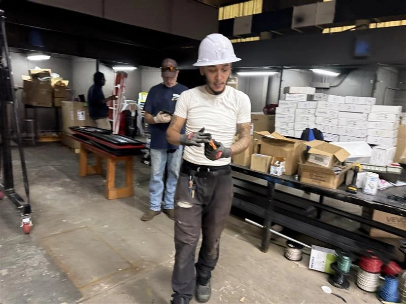 Instructor and Students in a Working Shop Environment 